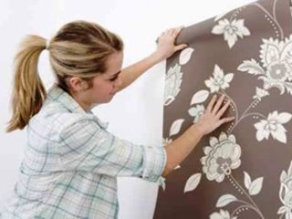 Woman holding wallpaper